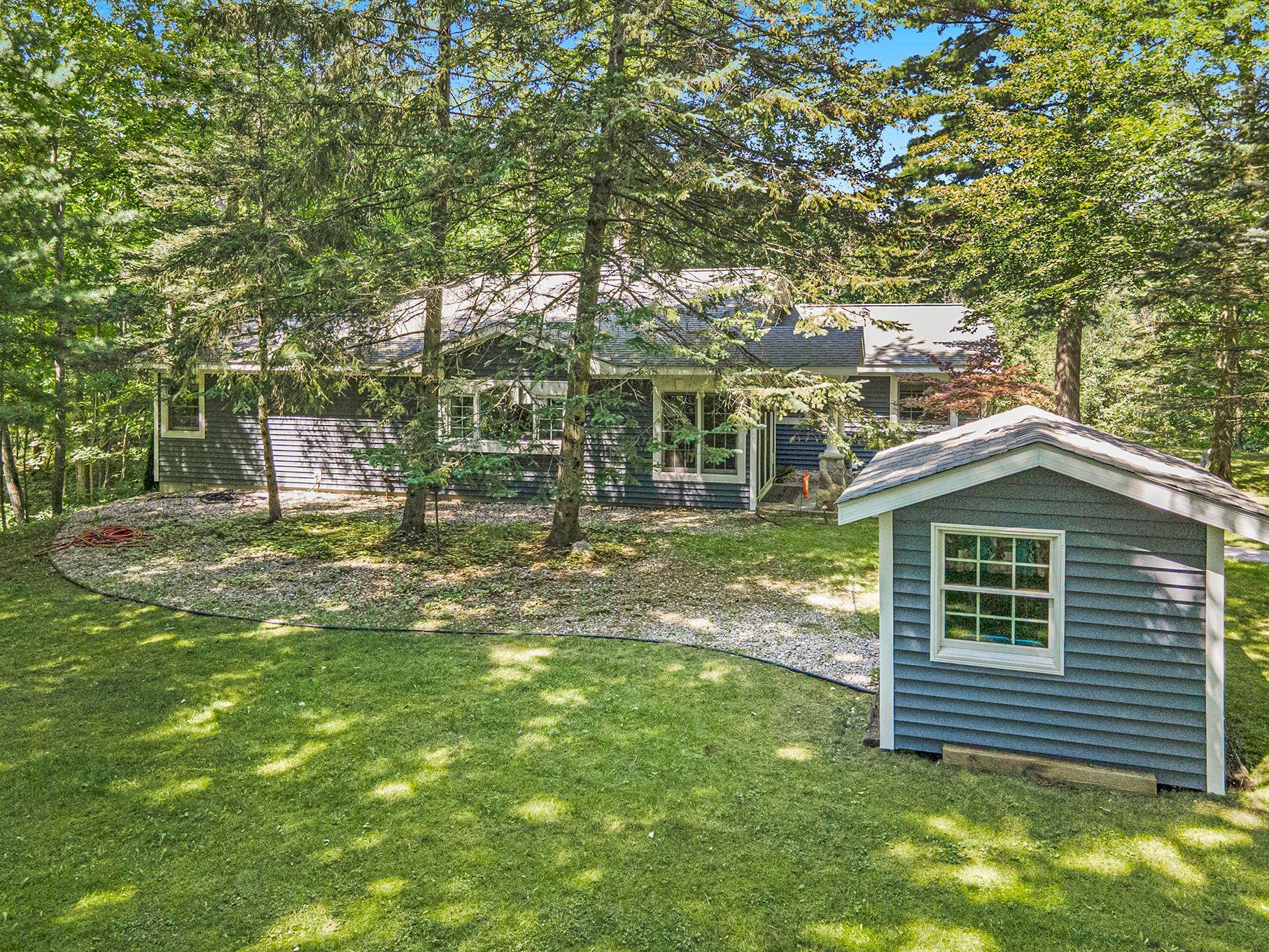 18753 Rapids Road Thompsonville, MI 49683 - Photo 4 of 46 south side and garden shed
