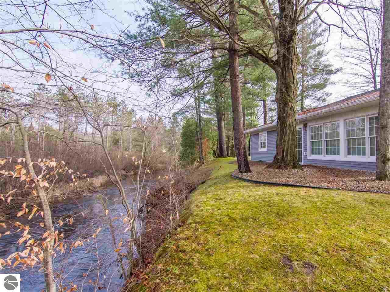 18753 Rapids Road Thompsonville, MI 49683 - Photo 5 of 46 front with river