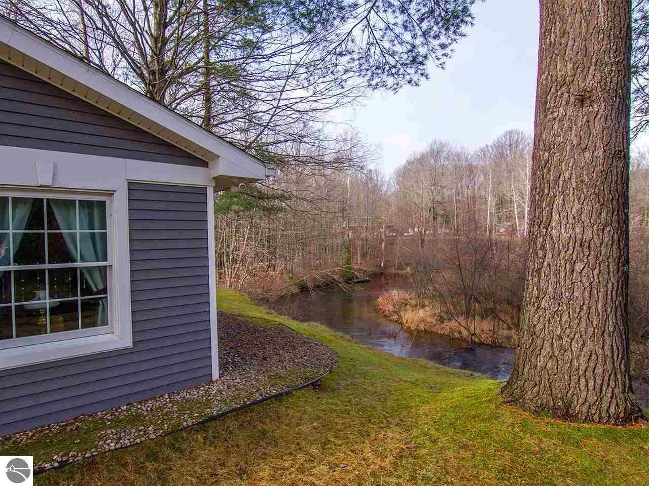 18753 Rapids Road Thompsonville, MI 49683 - Photo 6 of 46 front edge with river