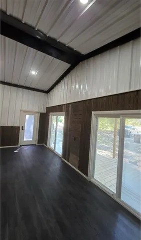 a kitchen with stainless steel appliances a refrigerator and a stove top oven