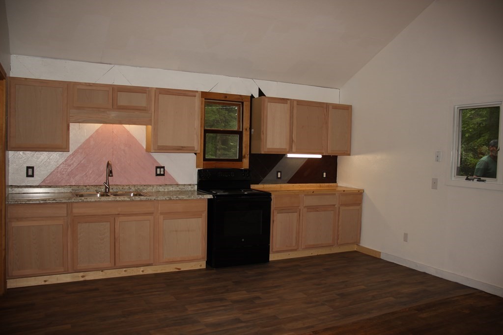 250 S Road Heath, MA 01346 - Photo 12 of 28 a kitchen with granite countertop a sink and a stove top oven