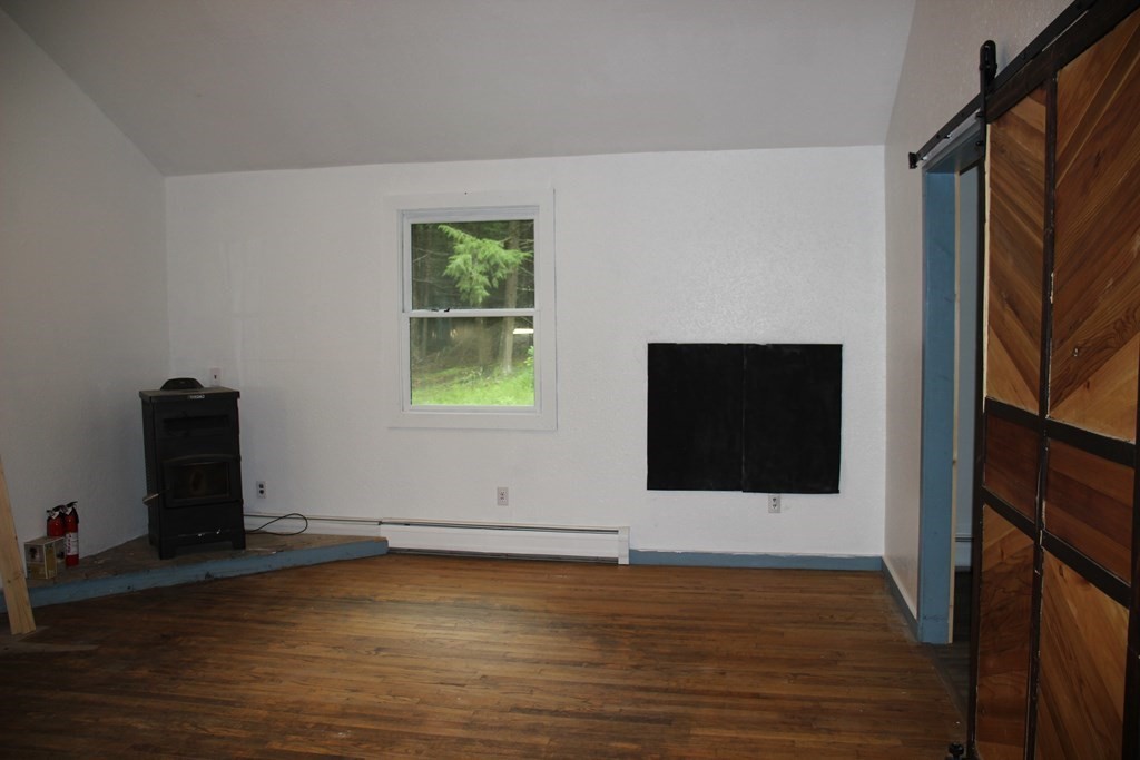 250 S Road Heath, MA 01346 - Photo 13 of 28 a view of an empty room with wooden floor and a window