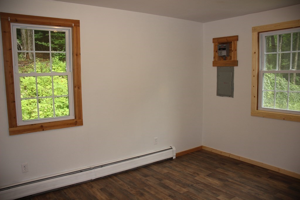 250 S Road Heath, MA 01346 - Photo 18 of 28 an empty room with wooden floor and a window