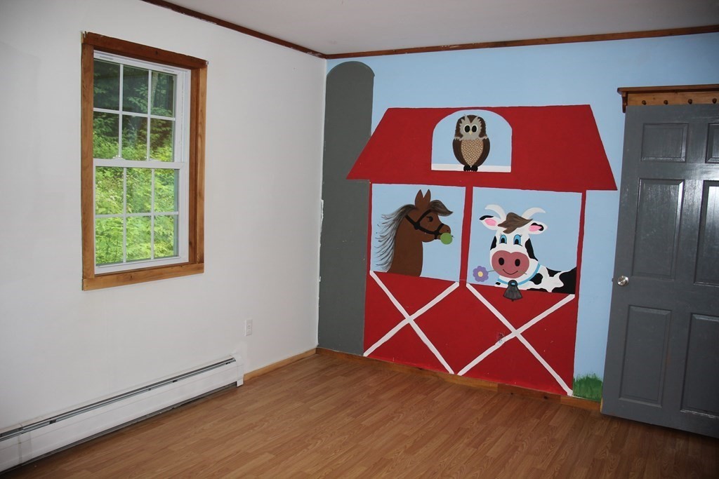 250 S Road Heath, MA 01346 - Photo 21 of 28 an empty room with windows and wooden floor