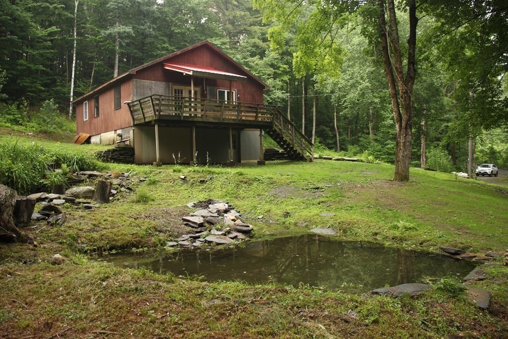 250 S Road Heath, MA 01346 - Photo 3 of 28 a backyard of a house with a yard swimming pool and outdoor seating