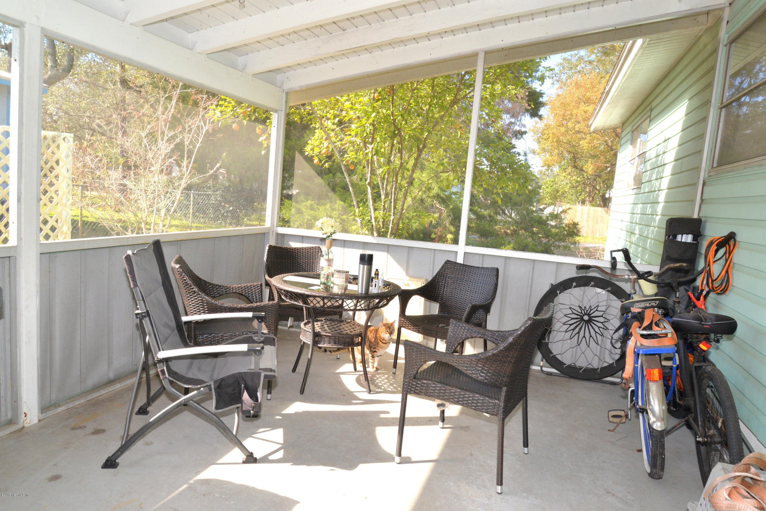 900 Palermo Road St. Augustine, FL 32086 - Photo 12 of 12 a dining room with furniture water view and a floor to ceiling window