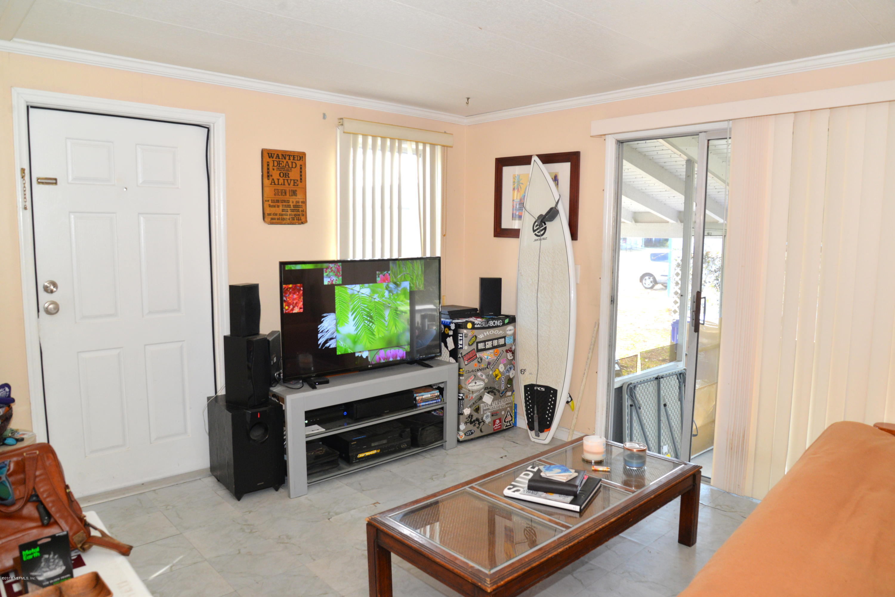 900 Palermo Road St. Augustine, FL 32086 - Photo 2 of 12 a living room with furniture and a flat screen tv