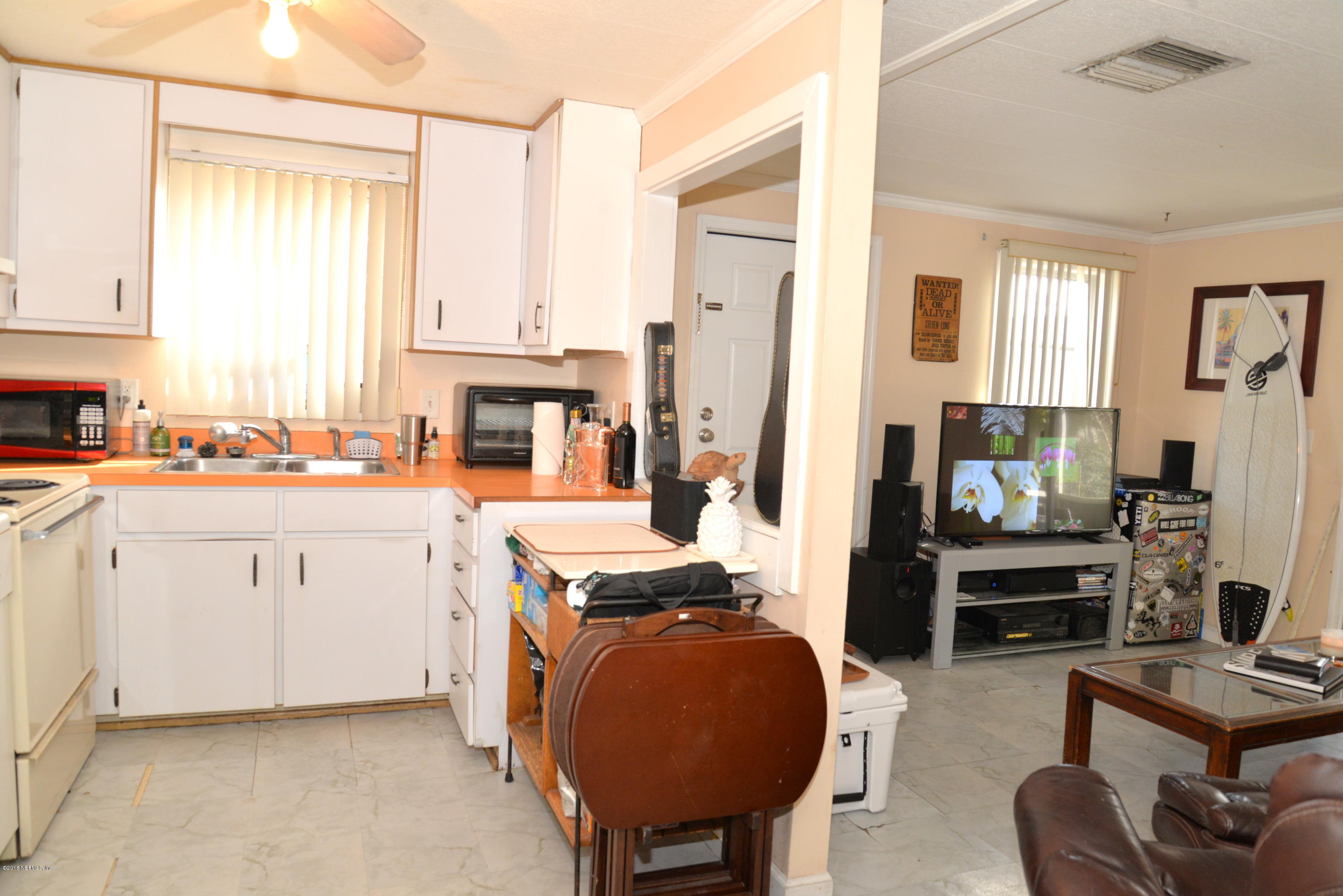 900 Palermo Road St. Augustine, FL 32086 - Photo 4 of 12 a open kitchen with stainless steel appliances granite countertop a stove and a refrigerator