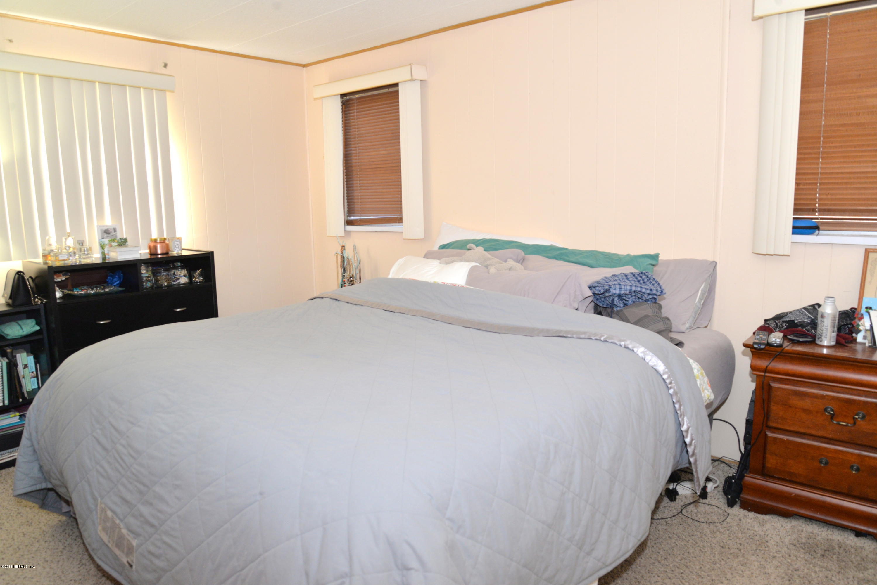 900 Palermo Road St. Augustine, FL 32086 - Photo 8 of 12 a bedroom with a bed and a window