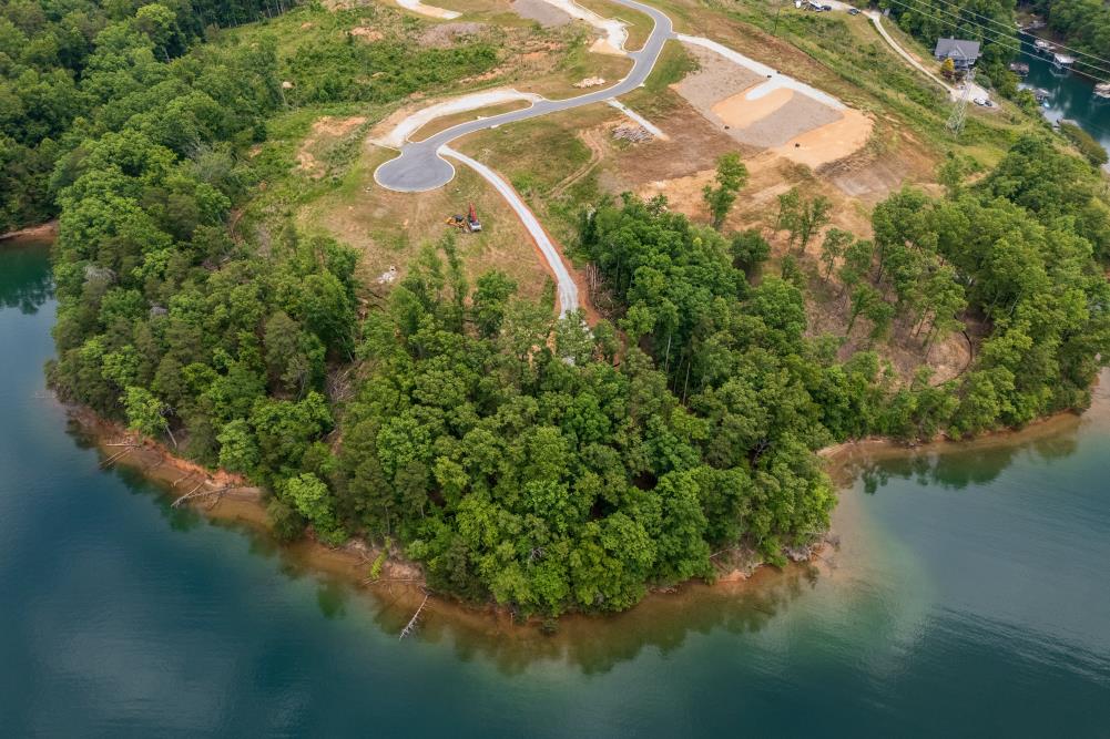 4 Warpath Ridge Trail Six Mile, SC 29682 - Photo 8 of 16 A tranquil lakefront property awaits, offering verdant trees and pristine waterfront views.