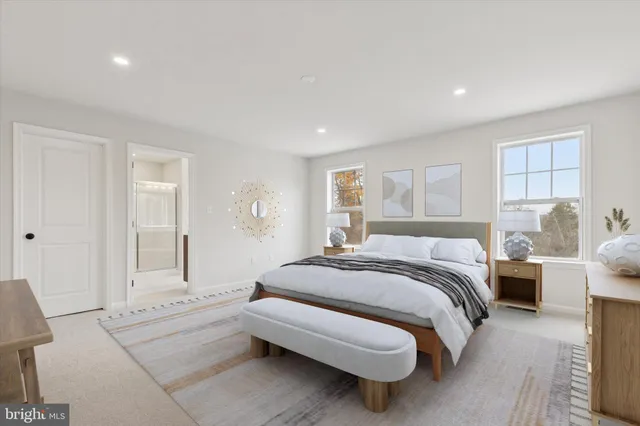 a spacious bedroom with a bed and a couch