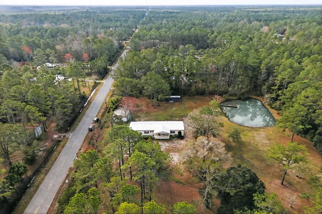 an aerial view of residential house with outdoor space