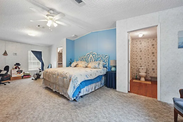 a living room with furniture a piano and a window