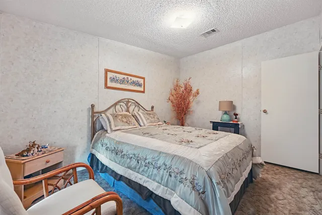 a bathroom with a toilet a sink and a shower