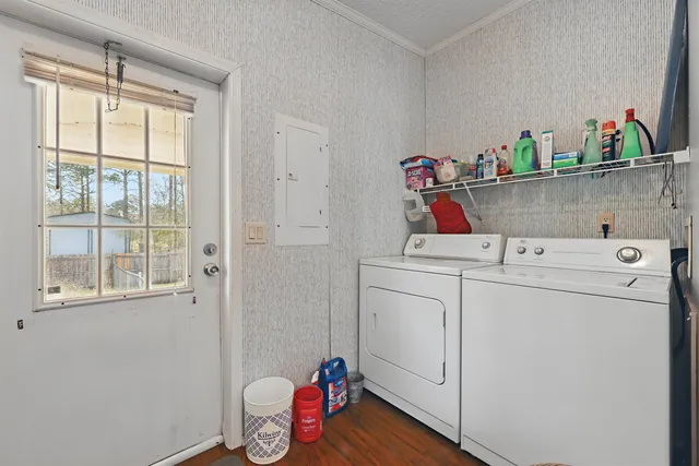 a view of a patio with table and chairs and wooden floor