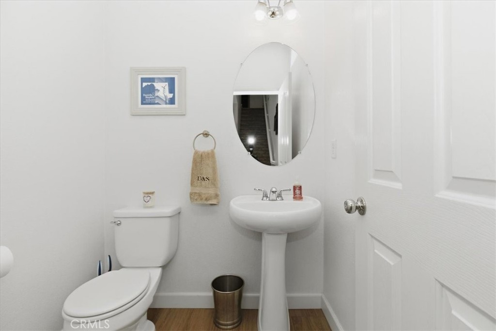 7353 Ellena West, Unit 70 Rancho Cucamonga, CA 91730 - Photo 19 of 40 a bathroom with a toilet sink and mirror
