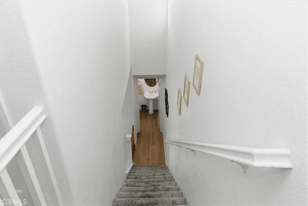 7353 Ellena West, Unit 70 Rancho Cucamonga, CA 91730 - Photo 20 of 40 a view of a hallway with white walls