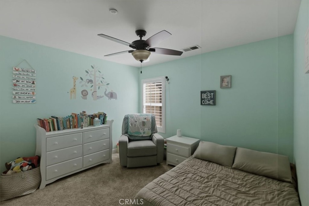7353 Ellena West, Unit 70 Rancho Cucamonga, CA 91730 - Photo 22 of 40 a living room with furniture and a window