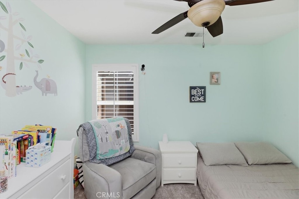 7353 Ellena West, Unit 70 Rancho Cucamonga, CA 91730 - Photo 23 of 40 a living room with furniture and a window