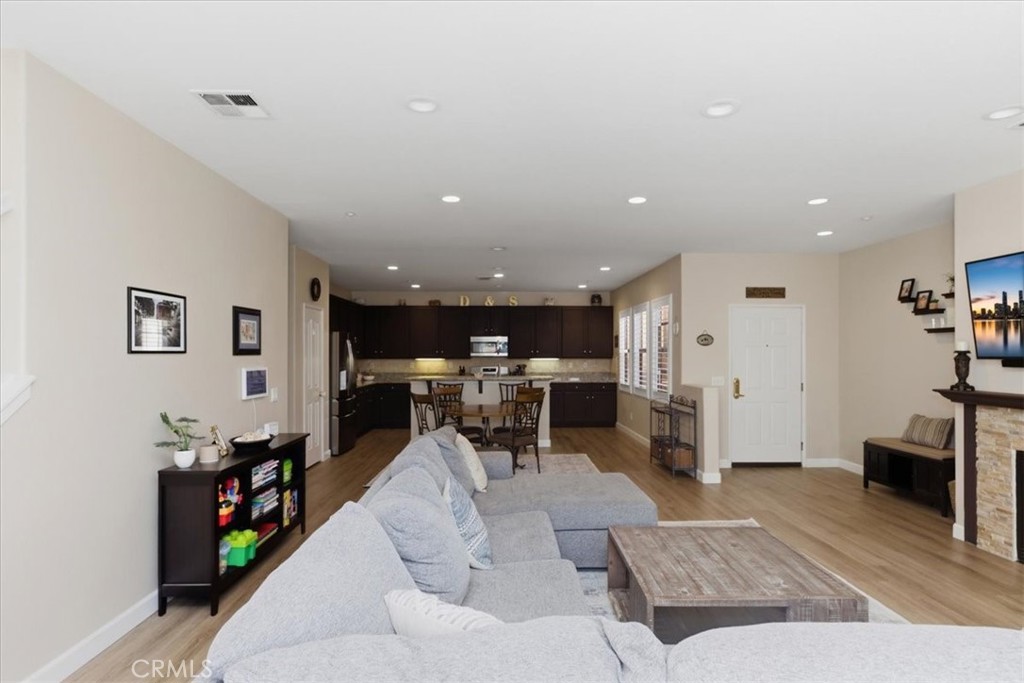 7353 Ellena West, Unit 70 Rancho Cucamonga, CA 91730 - Photo 10 of 40 a living room with furniture and a flat screen tv