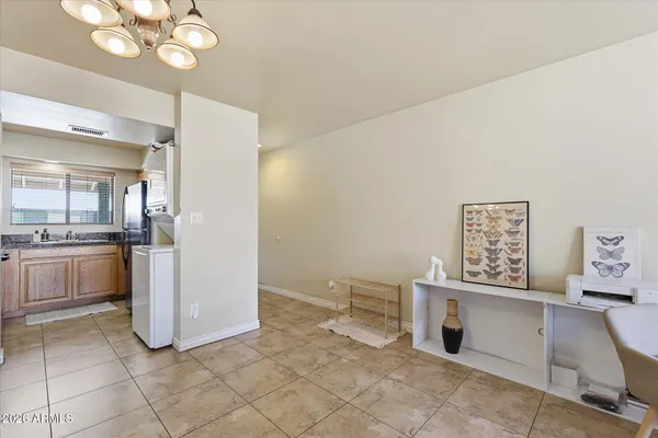 a view of a kitchen with a sink cabinets and wooden floor
