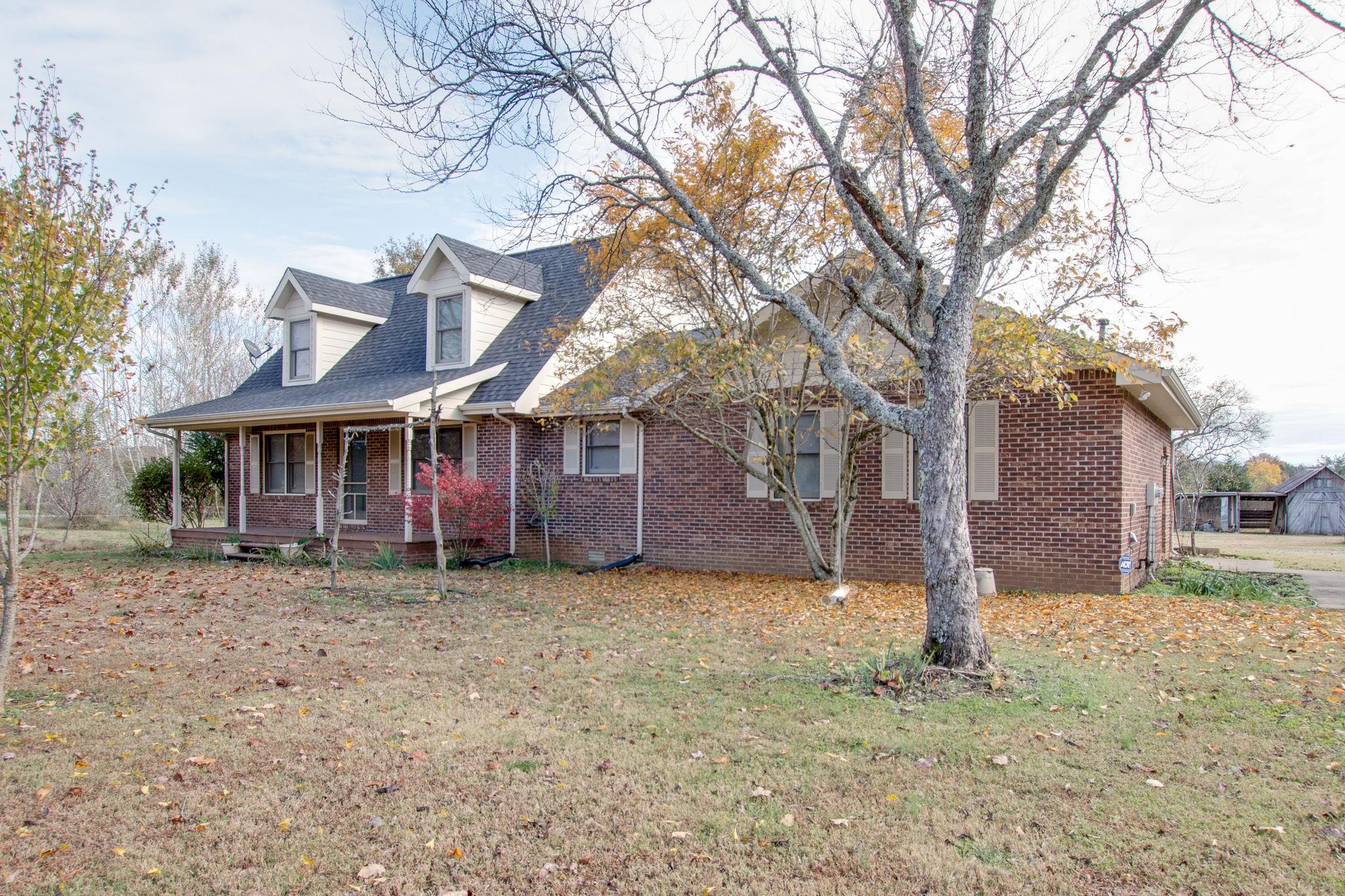 9464 Oregon Road Lascassas, TN 37085 - Photo 4 of 29 a front view of a house with a yard