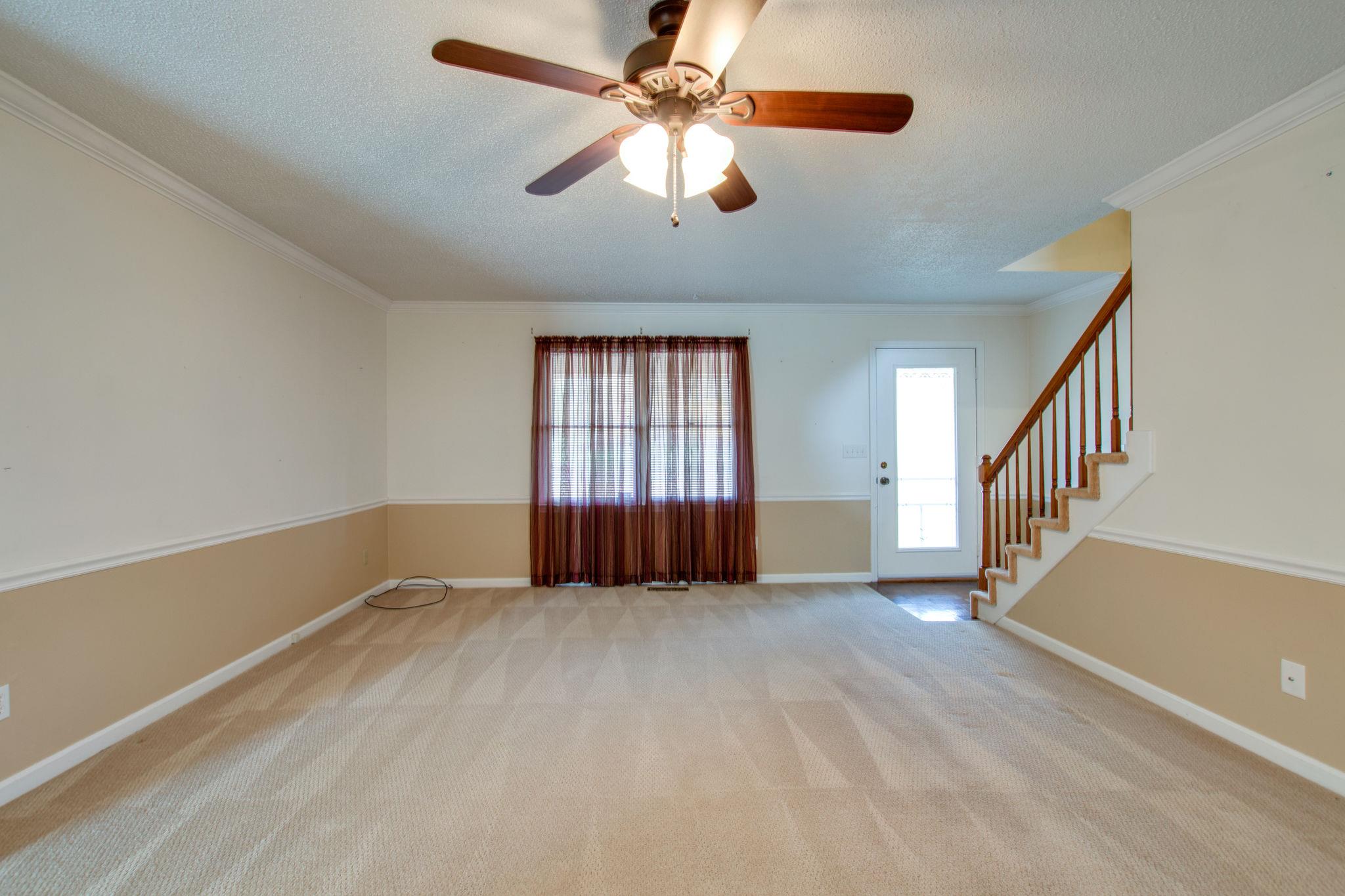 9464 Oregon Road Lascassas, TN 37085 - Photo 8 of 29 wooden floor in an empty room with a window