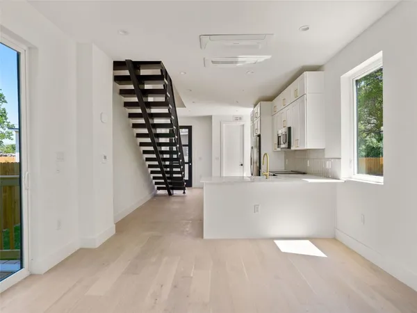 a view of kitchen and windows