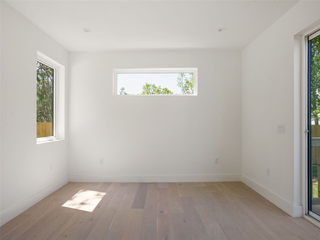 2609 Davis Lane, Unit 2 Austin, TX 78748 - Photo 13 of 26 an empty room with windows