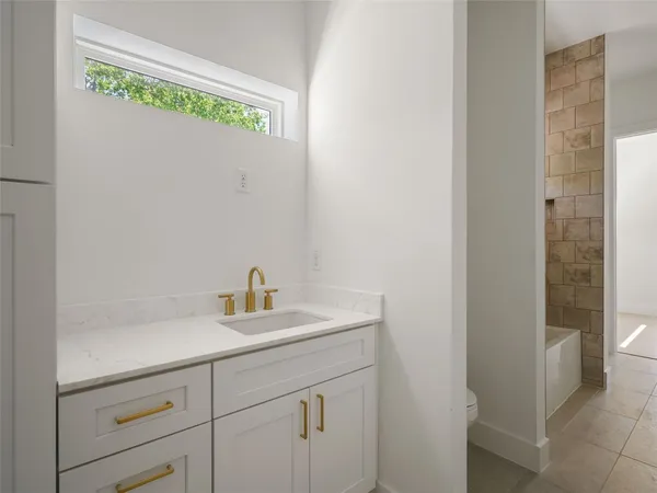 a bathroom with a sink and a vanity