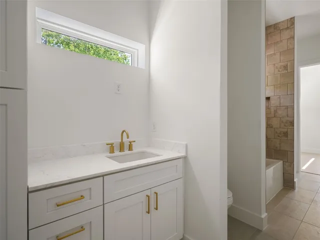 a bathroom with a sink and a vanity