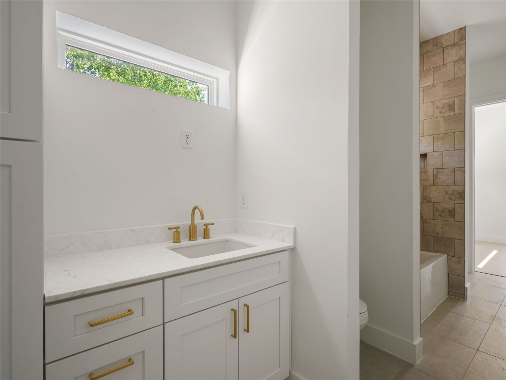 2609 Davis Lane, Unit 2 Austin, TX 78748 - Photo 19 of 26 a bathroom with a sink and a vanity
