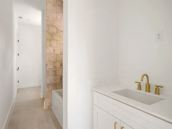 a bathroom with a sink and vanity