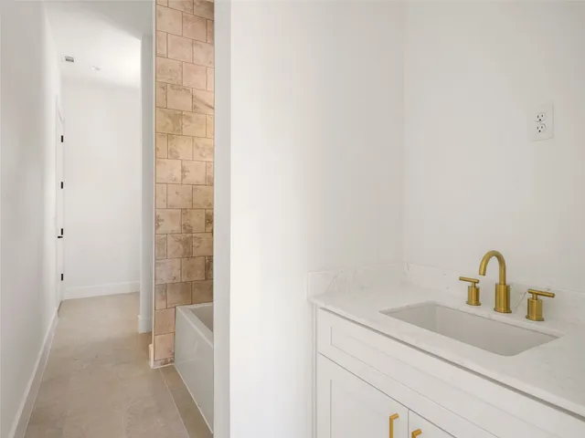 a bathroom with a sink and vanity
