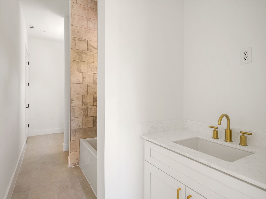 2609 Davis Lane, Unit 2 Austin, TX 78748 - Photo 20 of 26 a bathroom with a sink and vanity