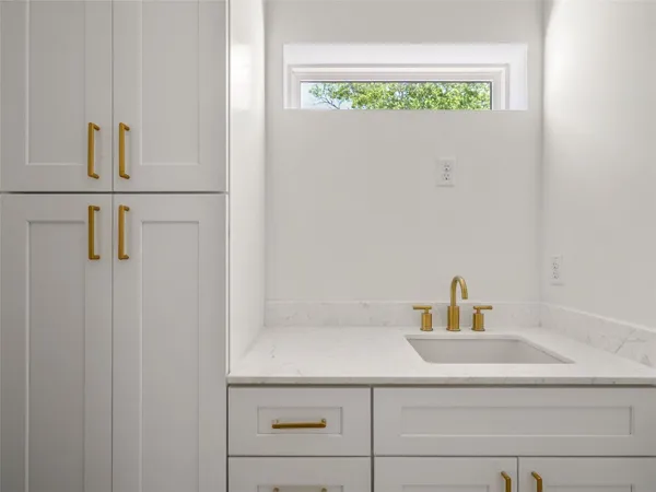 a bathroom with a sink and a window