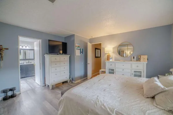 a bedroom with a bed and a television in it