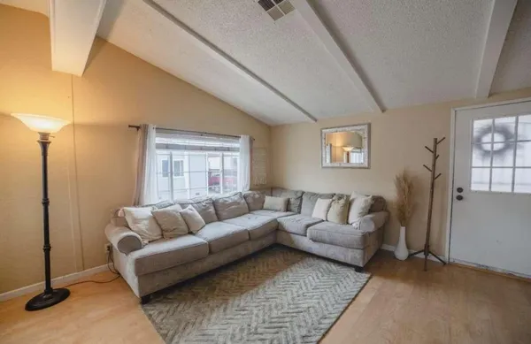 a living room with furniture and a couch