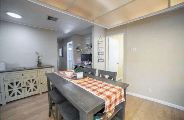 a dining room with furniture and window
