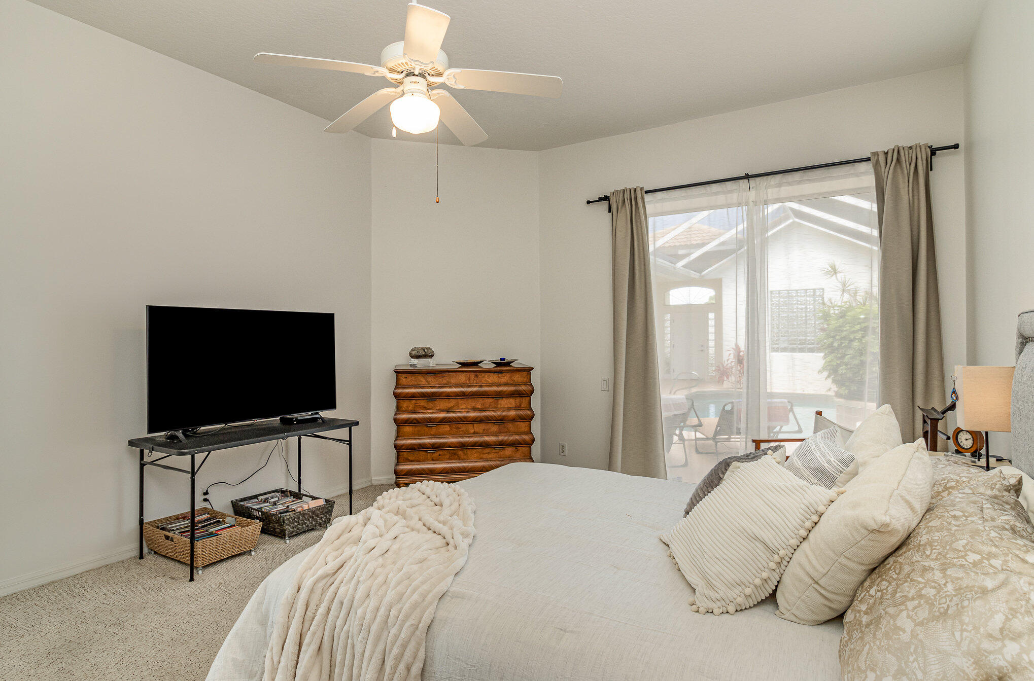 7951 Daventry Drive Melbourne, FL 32940 - Photo 20 of 46 a bedroom with a bed and a flat screen tv