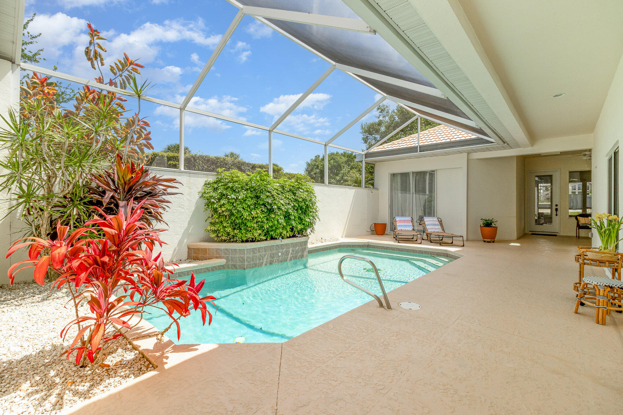 7951 Daventry Drive Melbourne, FL 32940 - Photo 2 of 46 a view of a swimming pool with potted plants