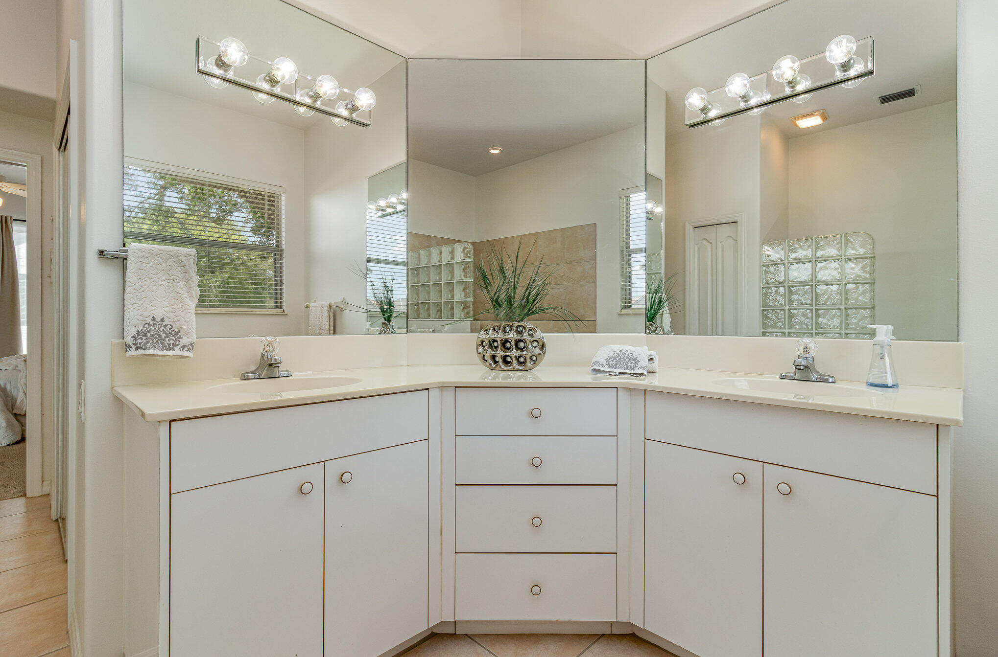 7951 Daventry Drive Melbourne, FL 32940 - Photo 22 of 46 a bathroom with double sink and a mirror