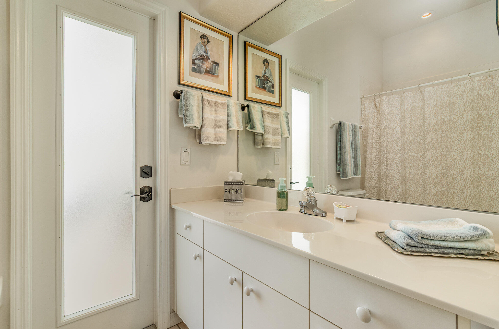 7951 Daventry Drive Melbourne, FL 32940 - Photo 26 of 46 a bathroom with a sink and a mirror