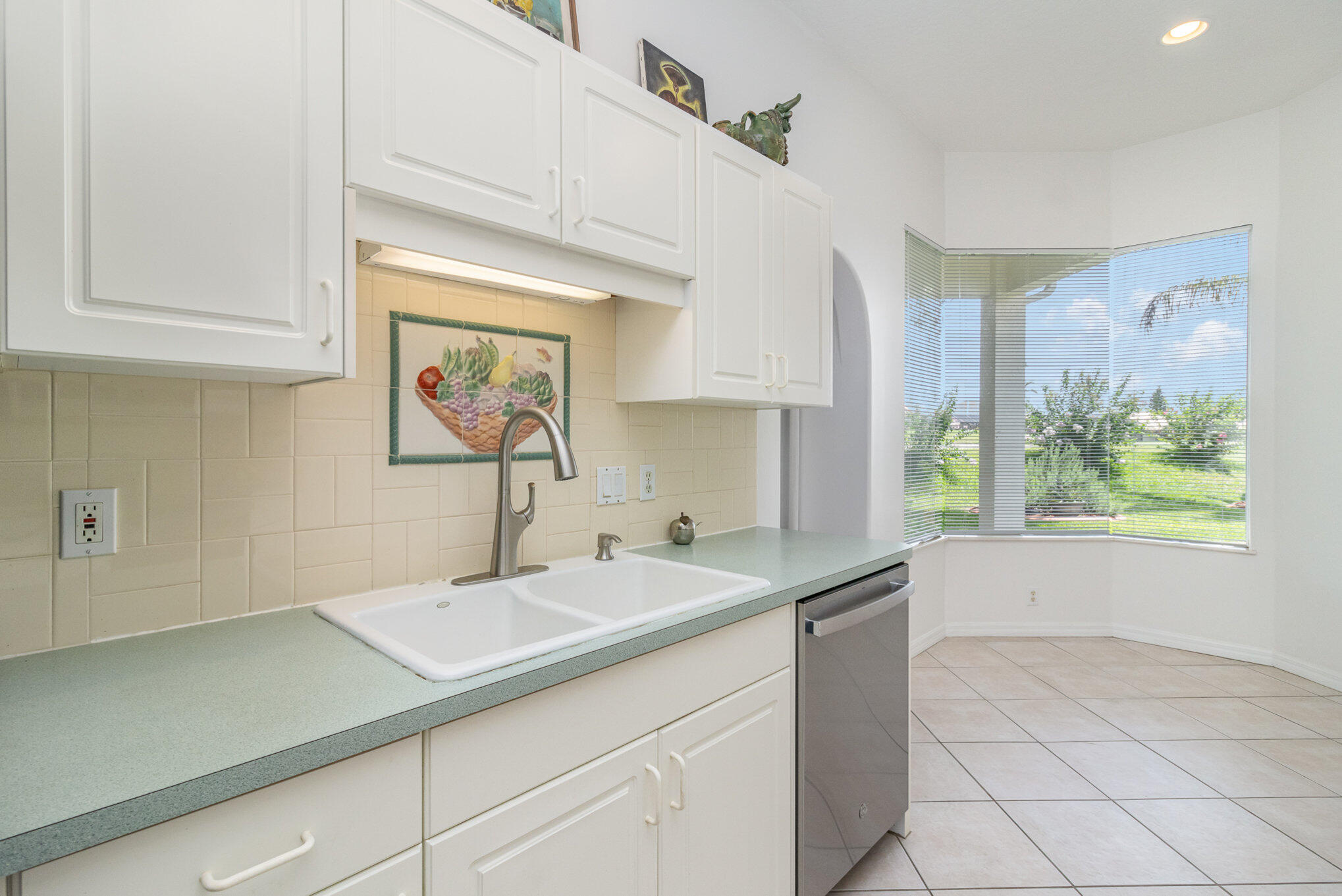 7951 Daventry Drive Melbourne, FL 32940 - Photo 10 of 46 a kitchen with a sink and cabinets