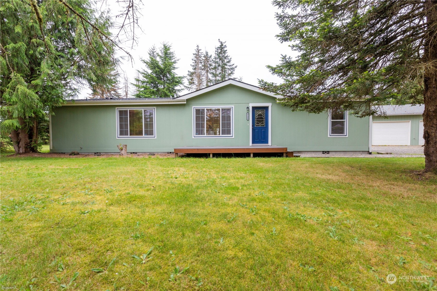 9138 176th Avenue Southwest Rochester, WA 98579 - Photo 1 of 25 a house with a tree in front of it