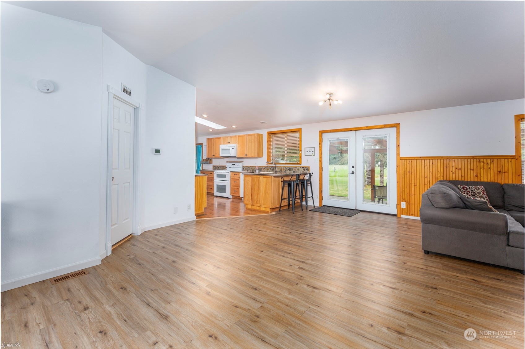 9138 176th Avenue Southwest Rochester, WA 98579 - Photo 13 of 25 wooden floor in an empty room with a window