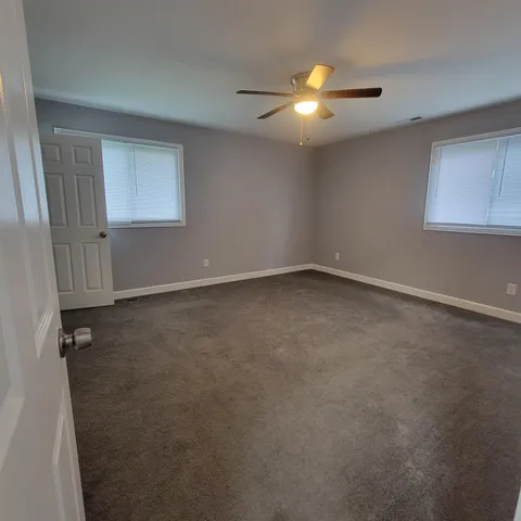 a bathroom with a bathtub and a toilet
