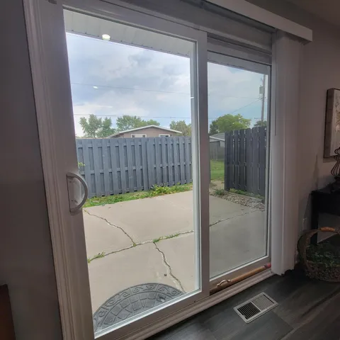 a backyard of a house with wooden fence