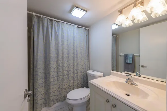 a bathroom with a toilet and a sink