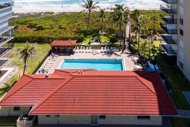a view of a balcony with wooden floor and fence